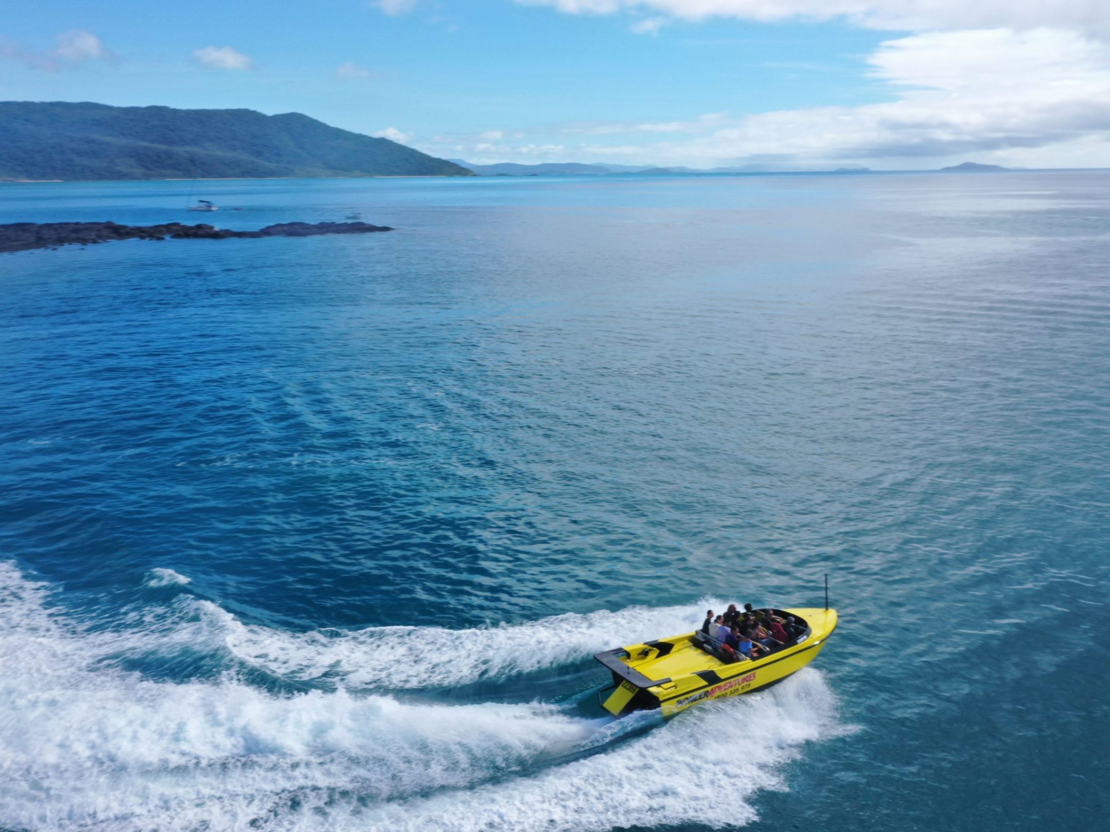 a man riding a wave on top of a body of water