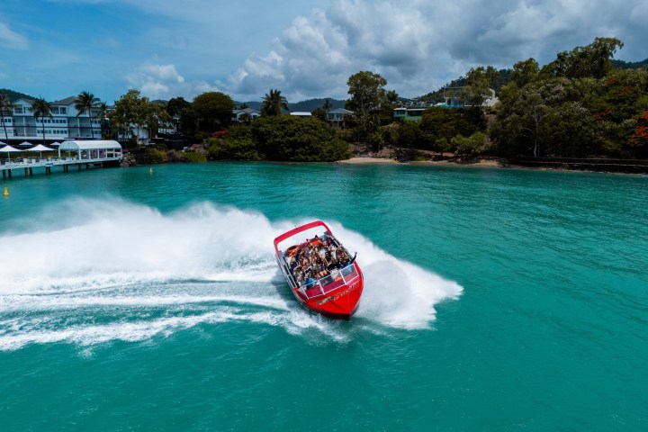 a man riding a wave on top of a body of water