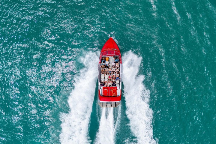 a person riding a wave on top of a body of water