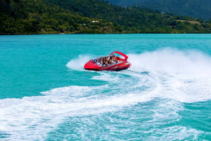 a body of water with a mountain in the background